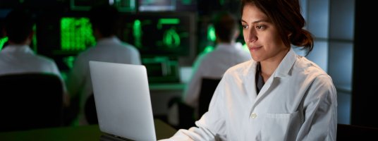 Female Medical Research Scientist using computer laptop by CarlosBarquero at Envato