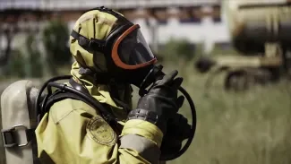 A firefighter in uniform. by Danil_Rudenko at Envato