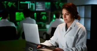 Female Medical Research Scientist using computer laptop by CarlosBarquero at Envato