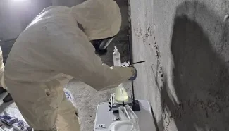 Man in PPE suit during field exercise 